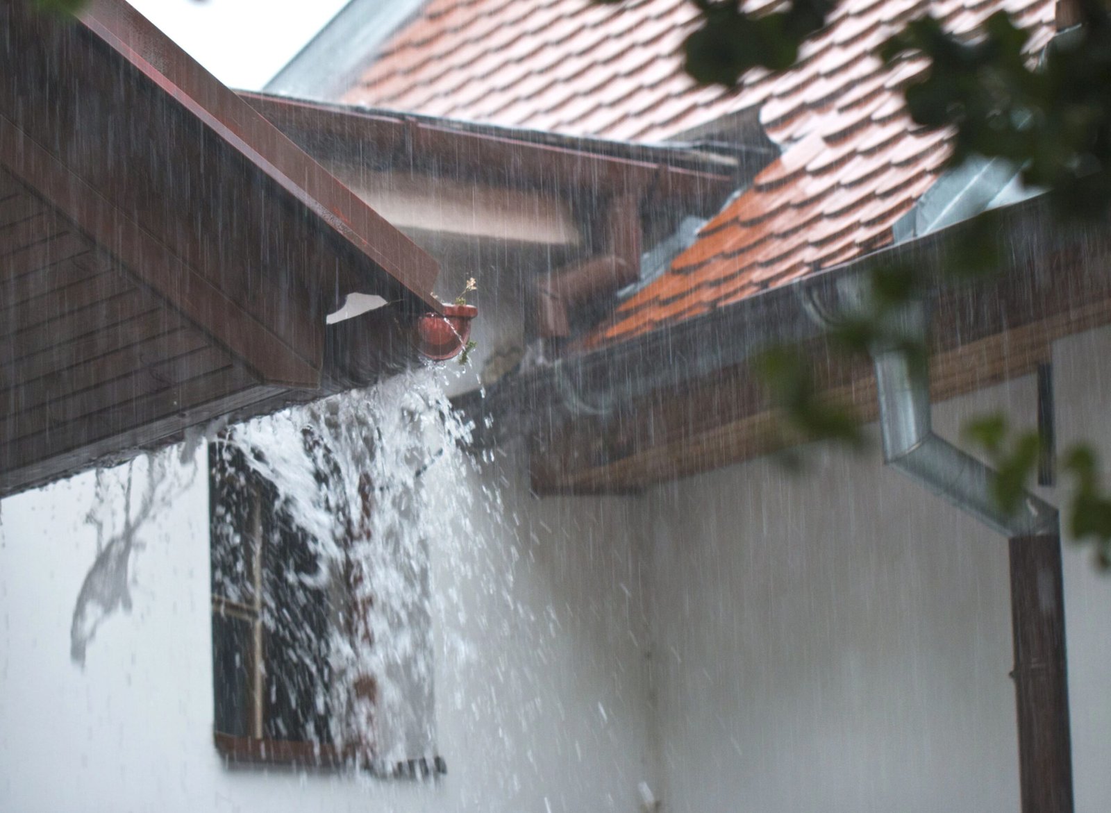rain overflowing from gutters